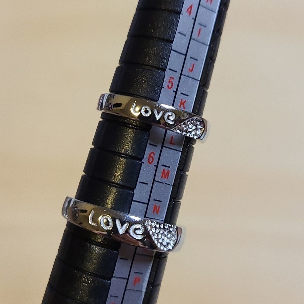 2 Sterling Silver couples rings Size 7 and 5.5 and their adjustable.